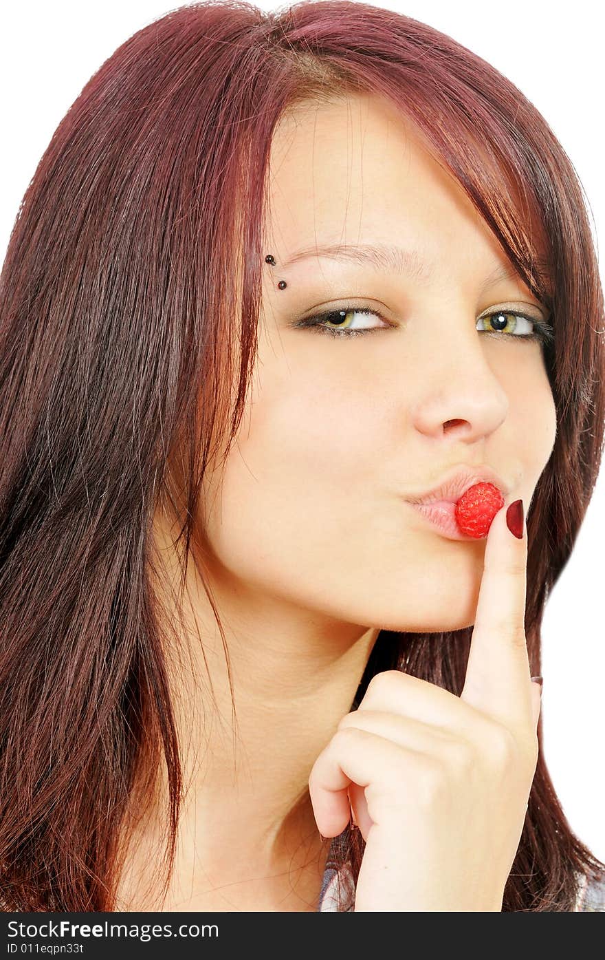 Beautiful girl with raspberry near her lips, isolated on white