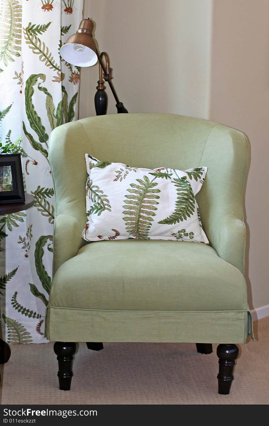 Comfy green chair and pillow