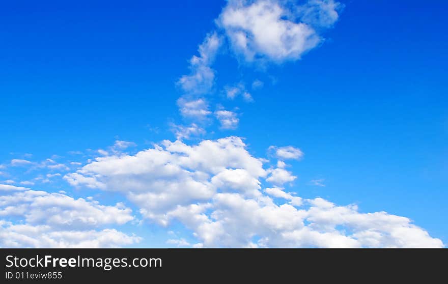 White cloud in the form of the head of giraffe against the bright blue background of summer sky. White cloud in the form of the head of giraffe against the bright blue background of summer sky.