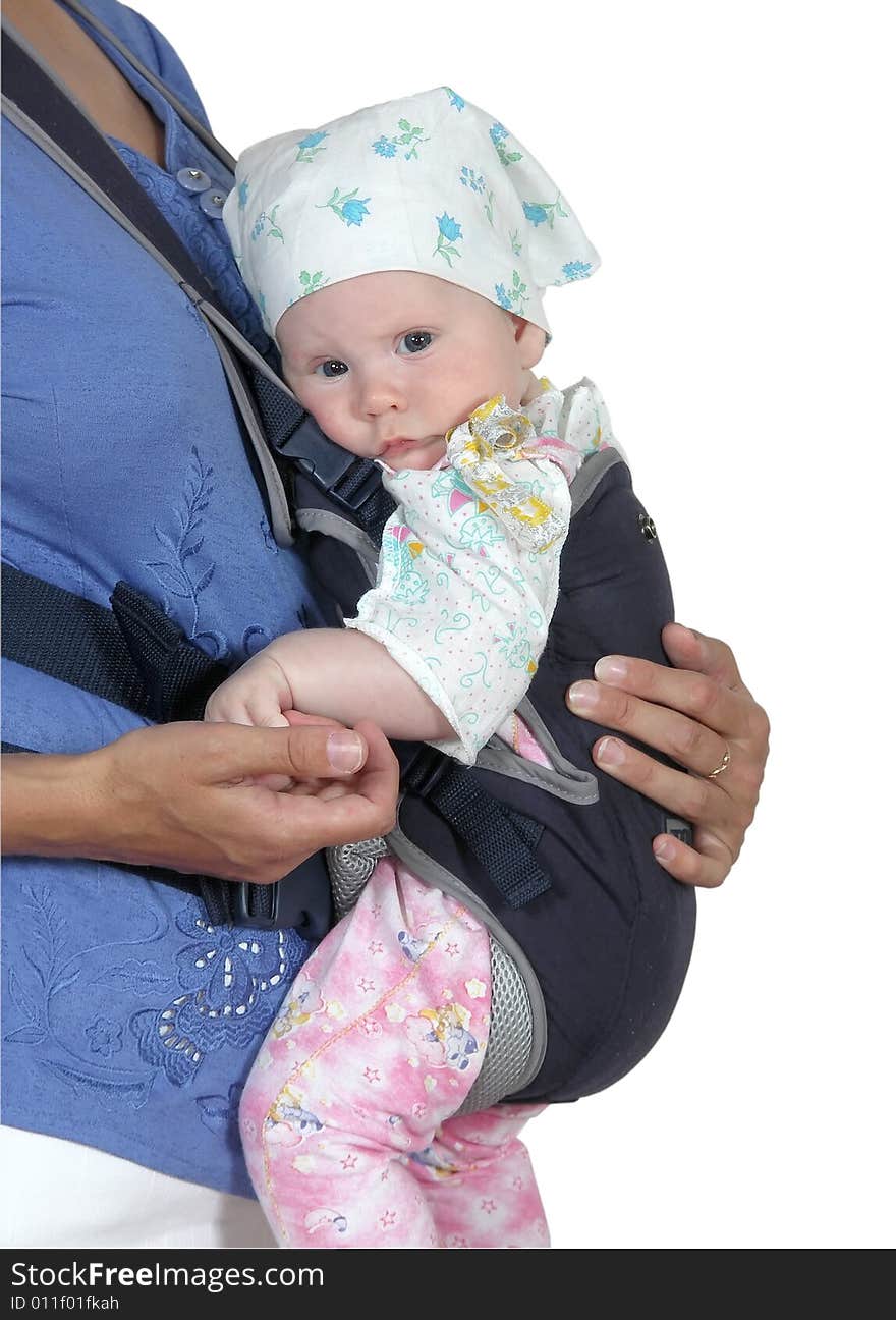 The child in a backpack on a breast of mother