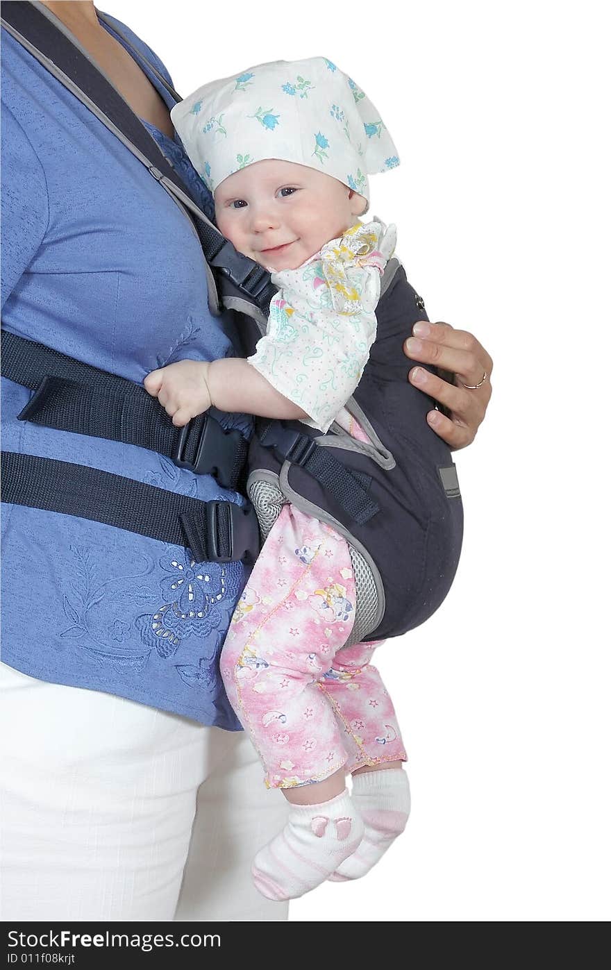 The child in a backpack on a breast of mother