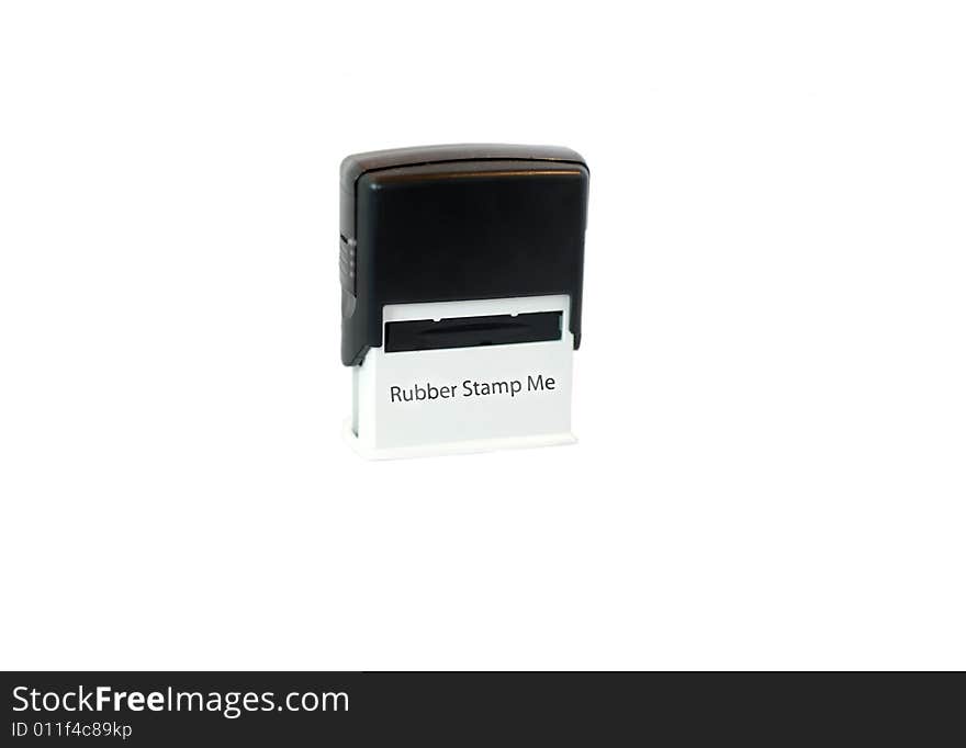 A photograph of an isolated rubber stamp printed with the text Rubber Stamp Me