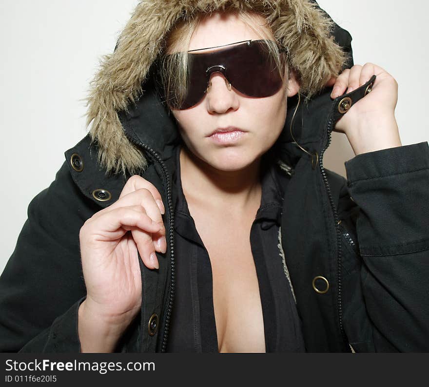 Beautiful girl in black  fur coat and sunglass. Beautiful girl in black  fur coat and sunglass