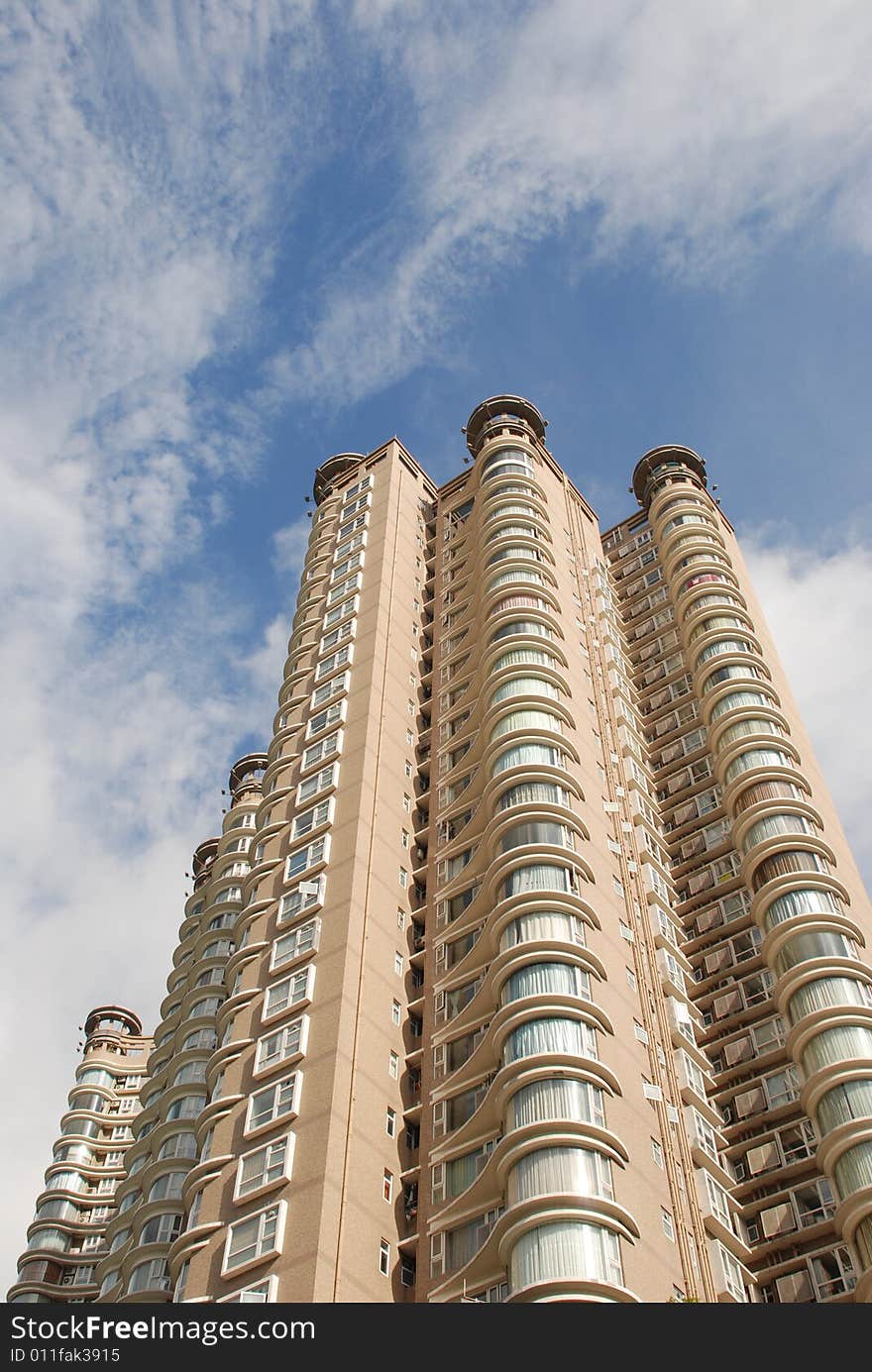 The apartment building high in the blue sky.