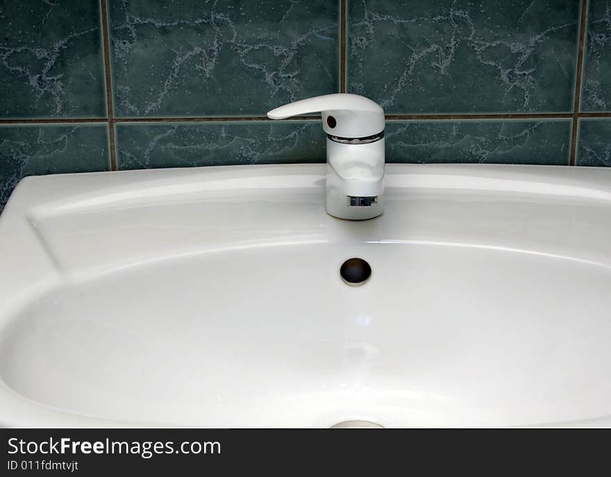 Modern bathroom detail with green tiles. Modern bathroom detail with green tiles