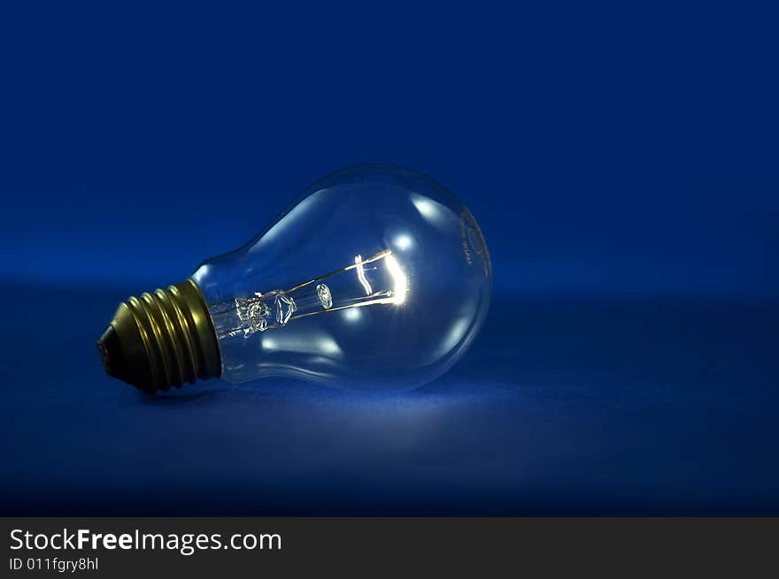 A bulb light on blue background. A bulb light on blue background