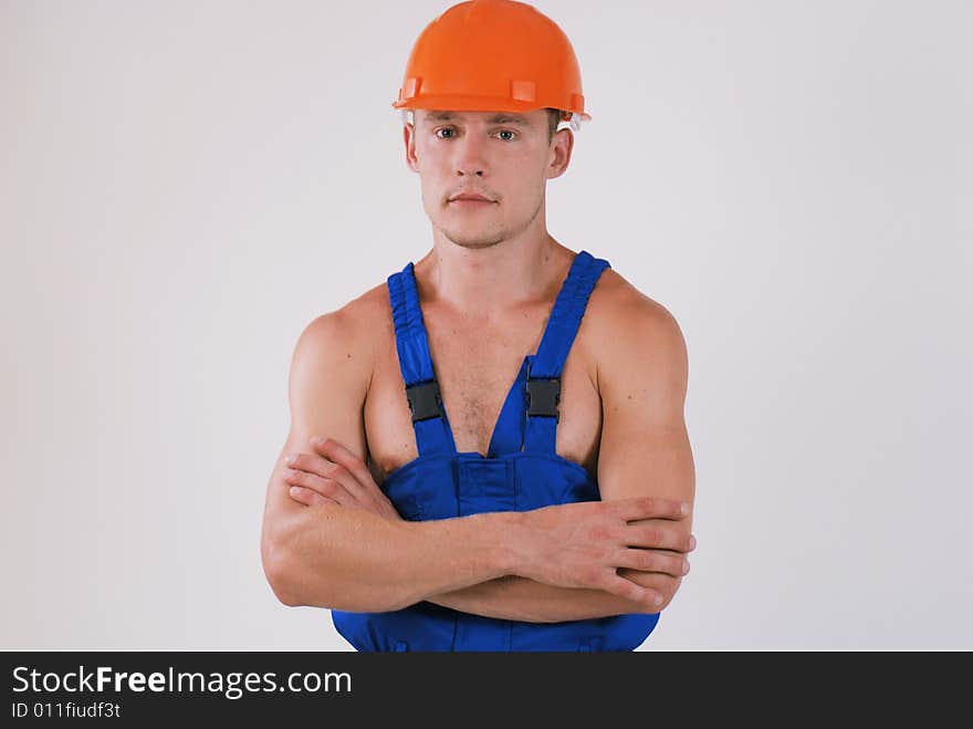 Horizontal image of worker in blue uniform and helmet