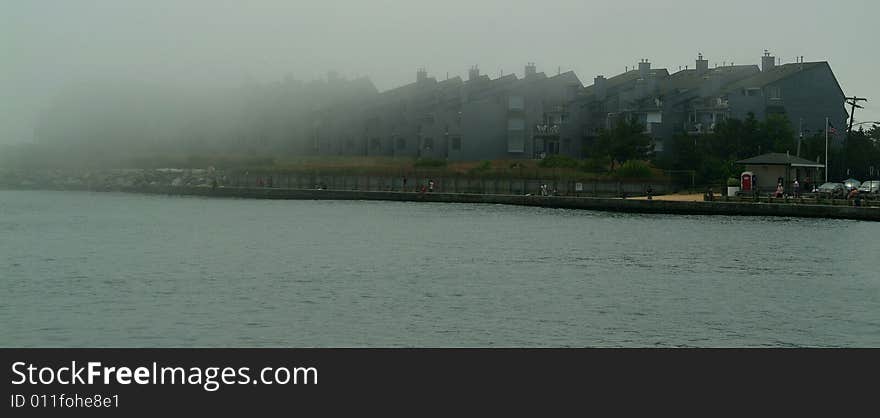 Condos in fog on the inlet