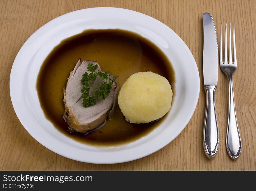 Bavarian roast pork dish with potato dumpling