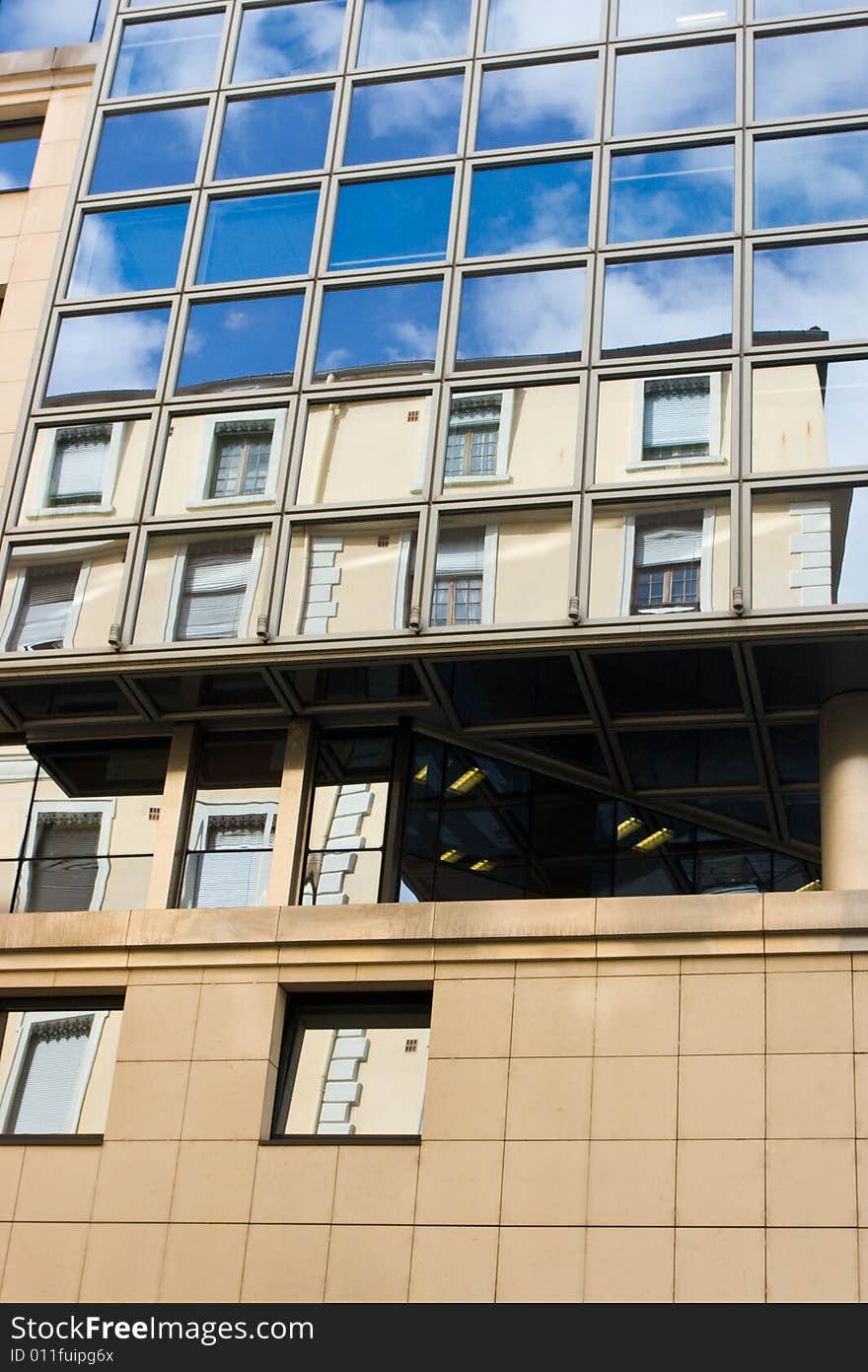 Old house reflected in office building windows. Old house reflected in office building windows