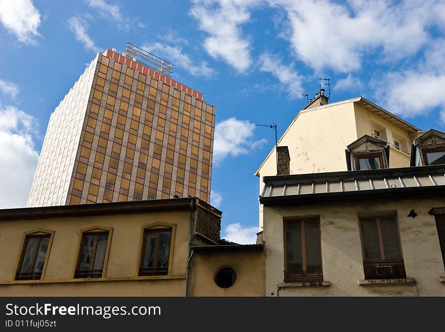 Modern office building behind old houses at the city of Lyon, France. Modern office building behind old houses at the city of Lyon, France