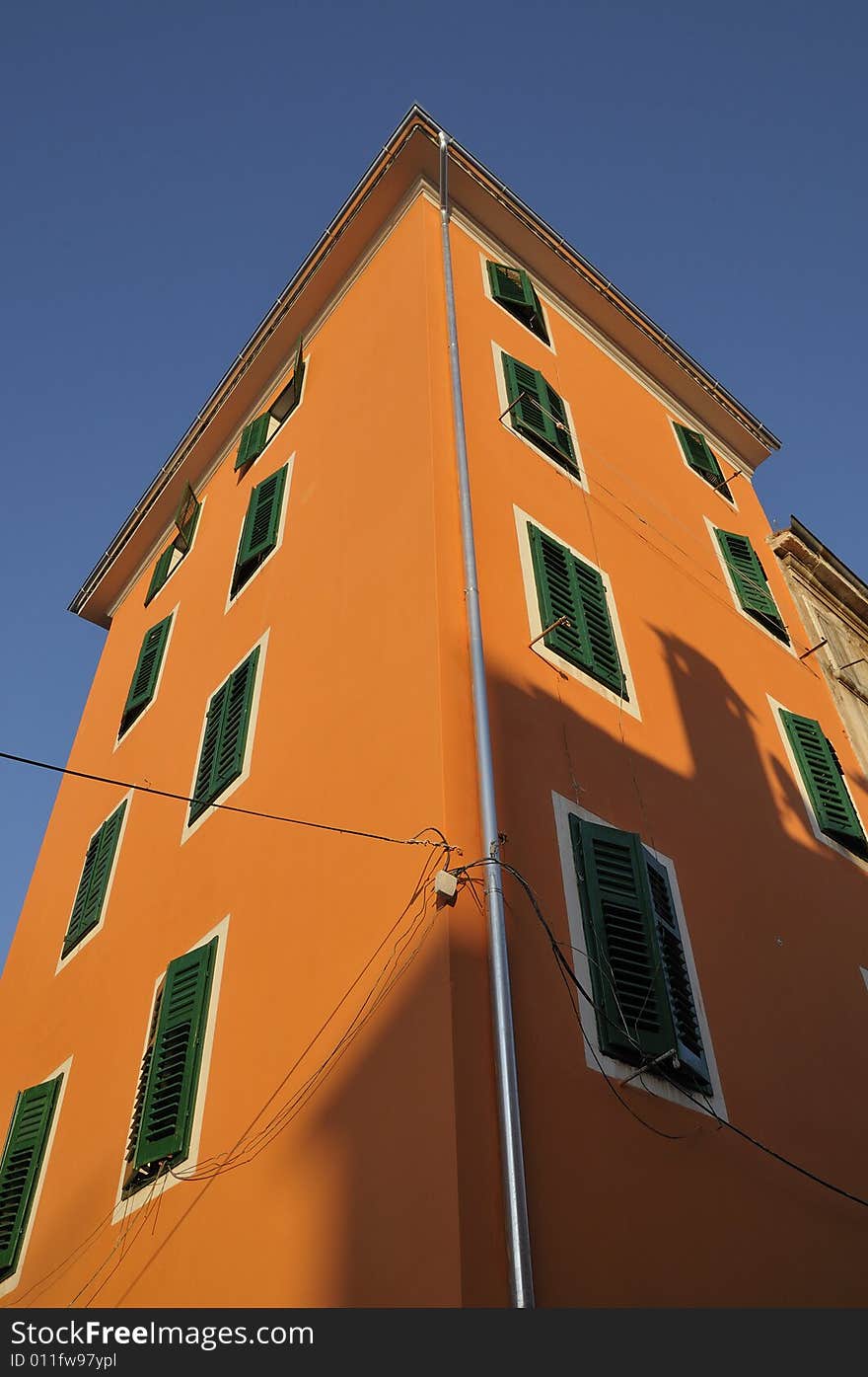 Orange house in city Rovinj in Croatia in summer