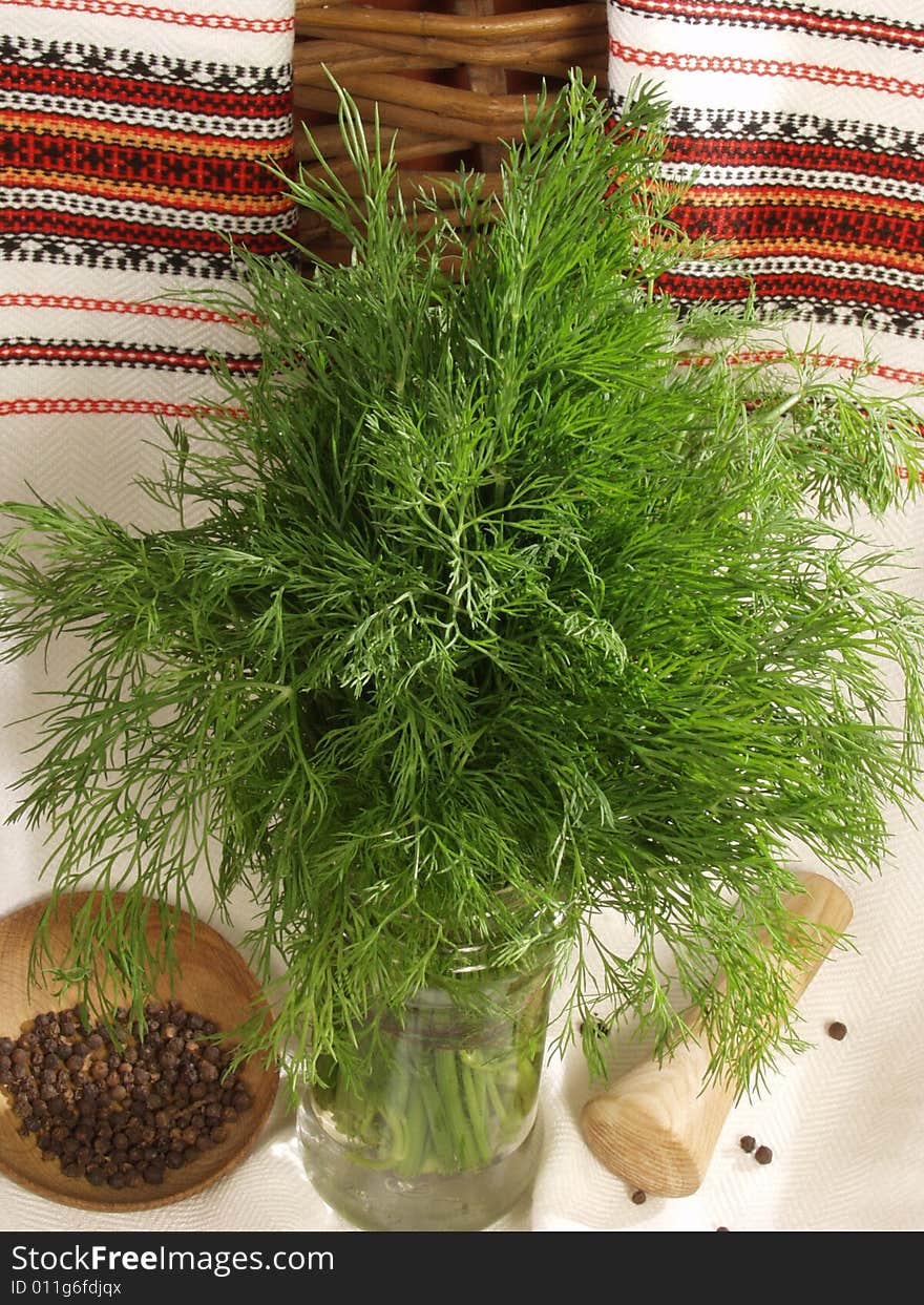 Fennel a bunch in a composition with fragrant pepper and the Ukrainian national towels. Fennel a bunch in a composition with fragrant pepper and the Ukrainian national towels