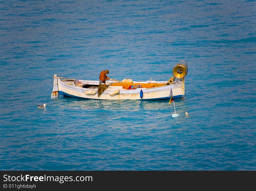 Fisherman in the water near the city nice in france