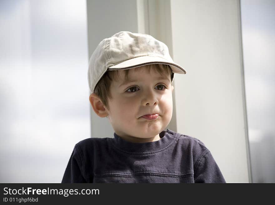 Kid with hat doing a funny face