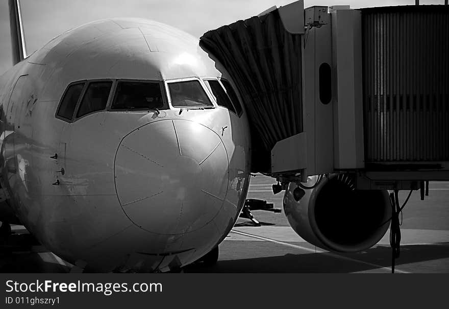 Airplane at gate shot in black and white