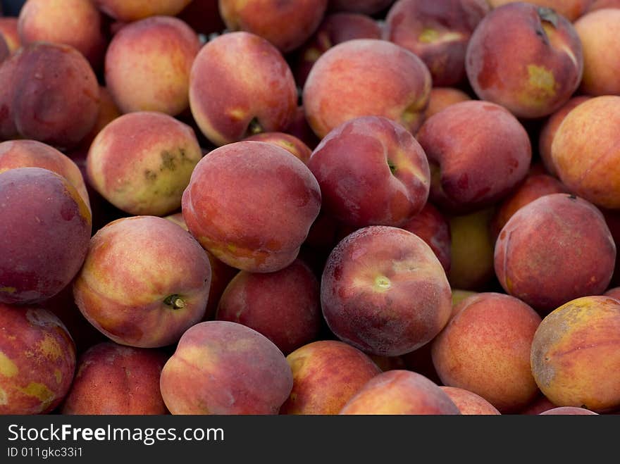 Beautiful peaches outside on a summer day.