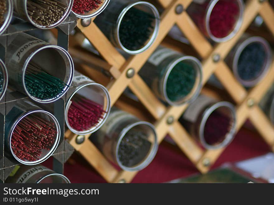 Containers filled with various incense sticks at the Farmer's Market.