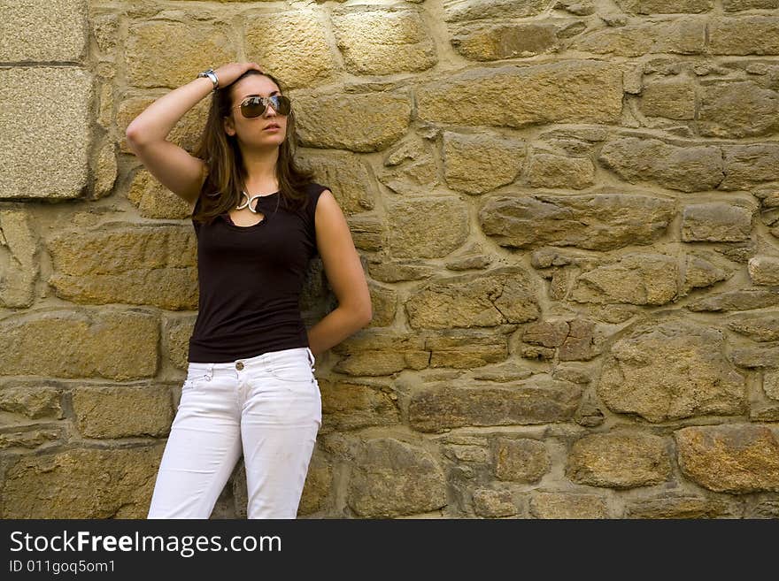 Shot of girl lining against the wall