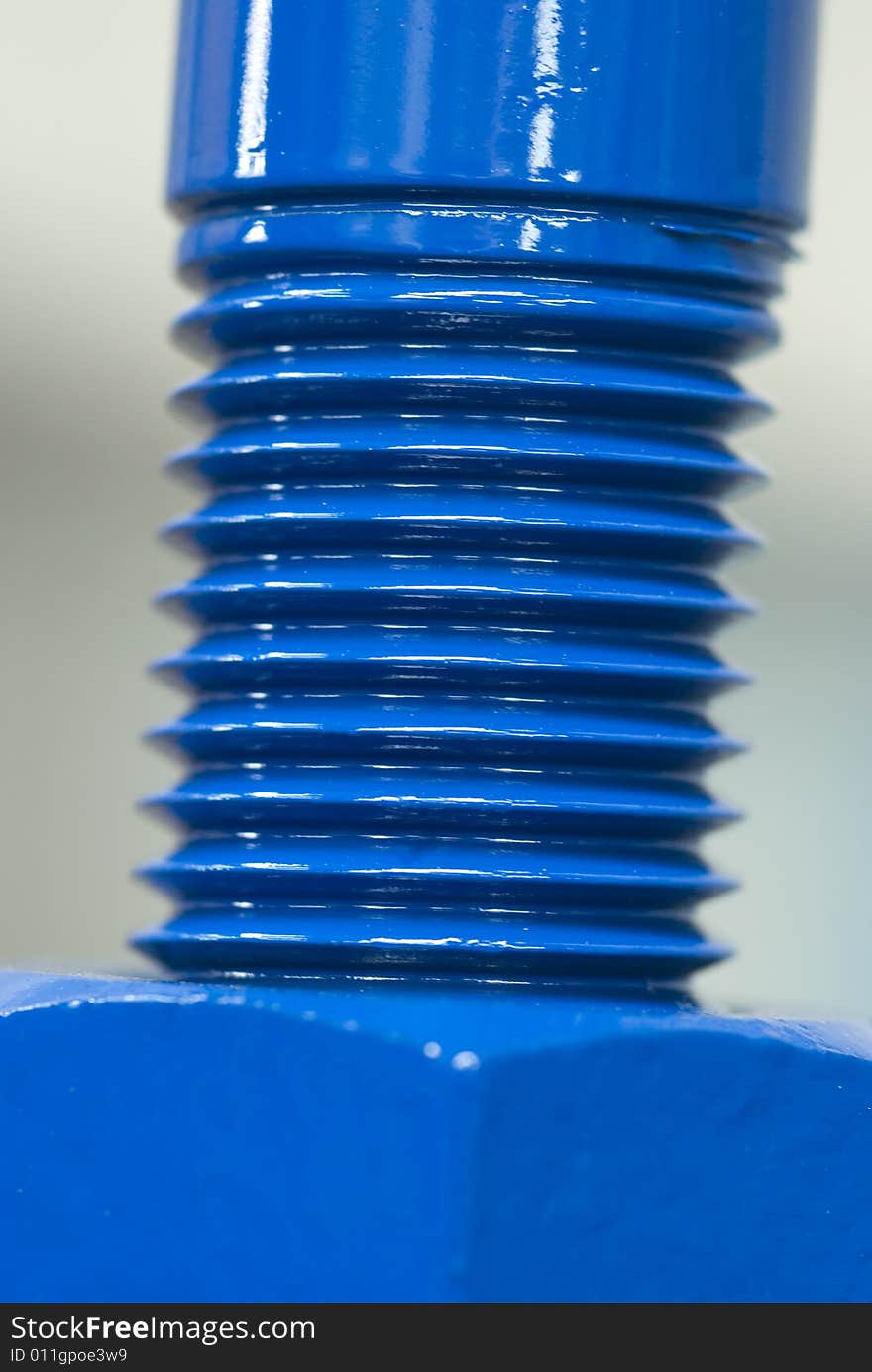 Close-up photo of shiny, blue nut and bolt