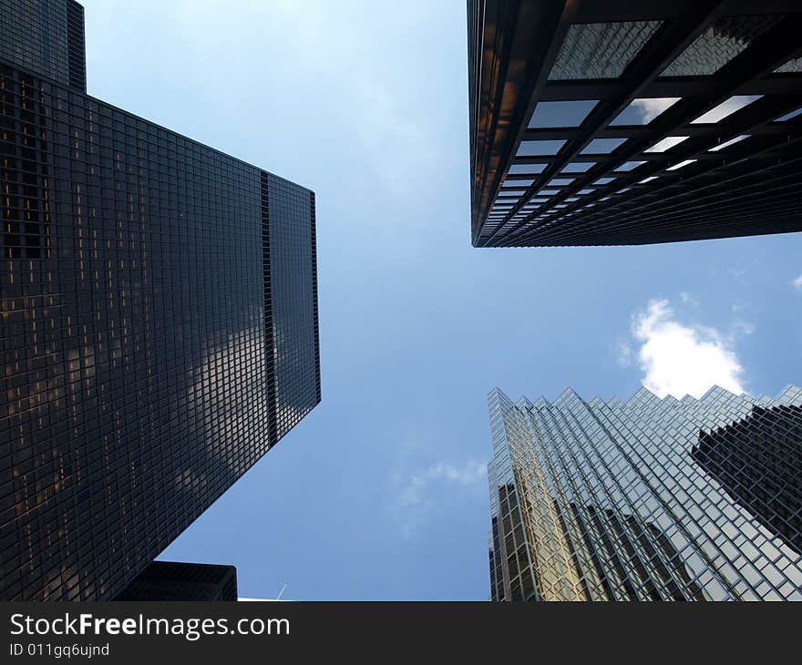 Looking up in the center of a selection of skyscrapers. Looking up in the center of a selection of skyscrapers.