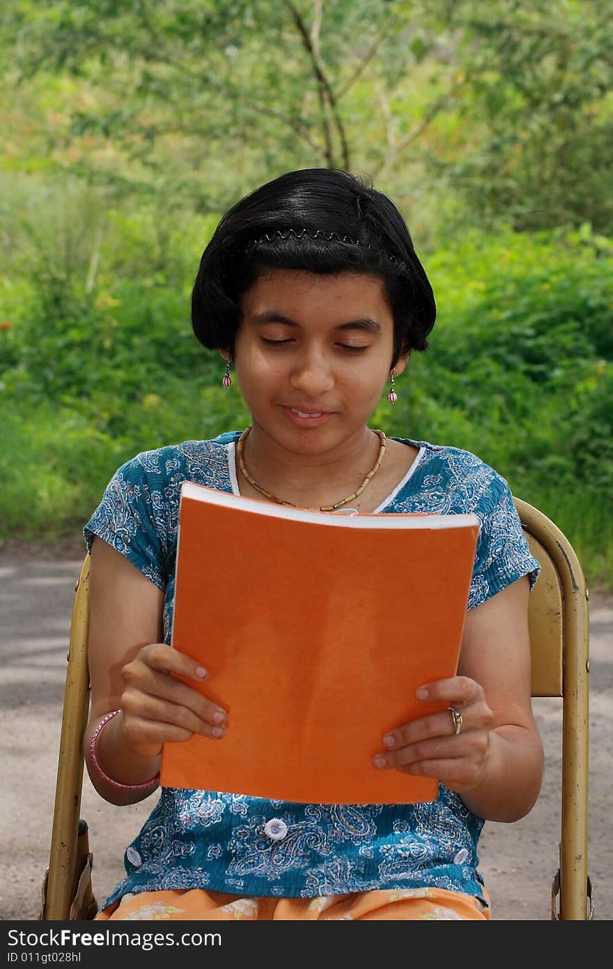 Girl reading the magazine