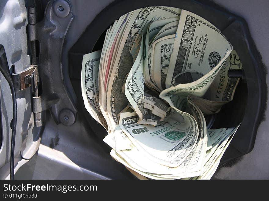 Hundreds of dollars stuffed into a gas tank. Hundreds of dollars stuffed into a gas tank.