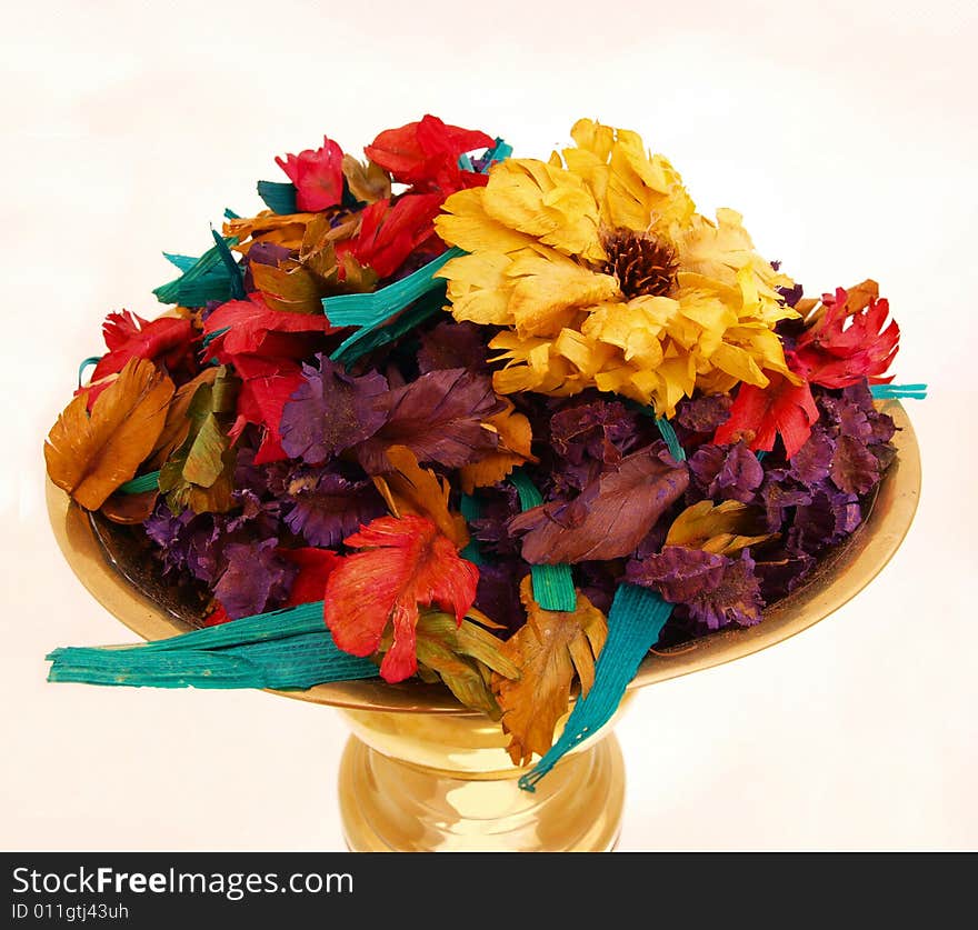 Potpourri on shiny bronze tray top view. Potpourri on shiny bronze tray top view