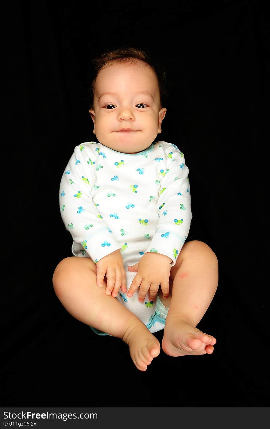 Baby boy isolated over black