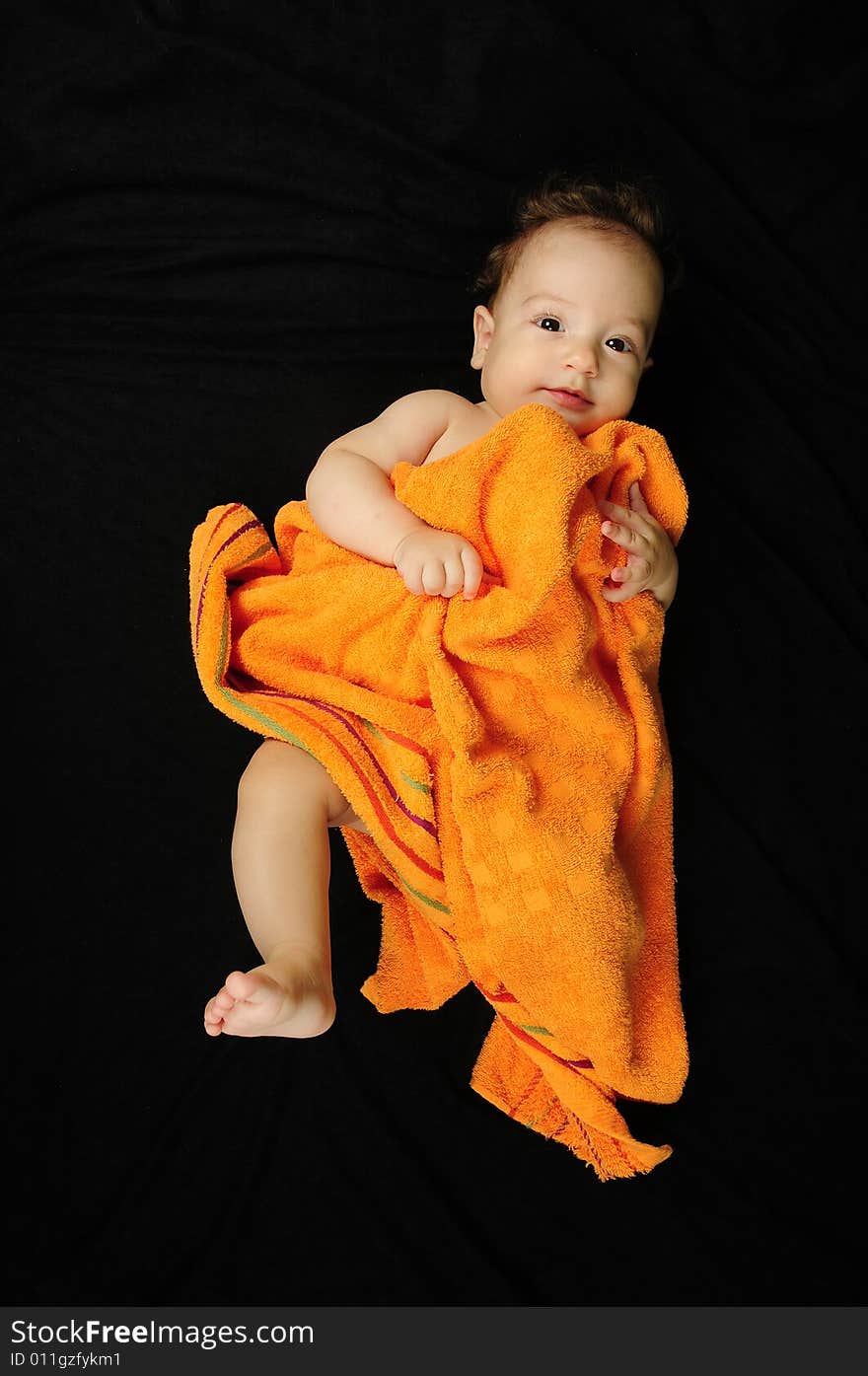 Baby boy isolated over black