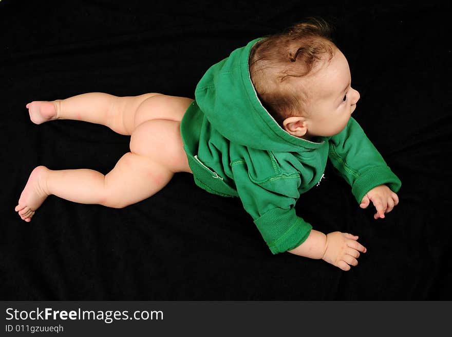 Baby boy isolated over black