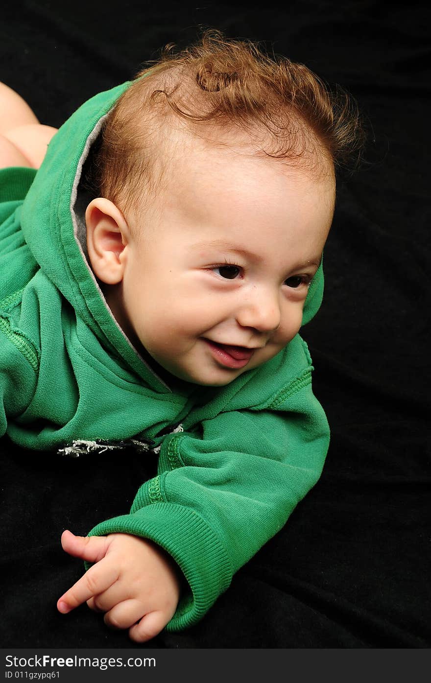 Baby boy isolated over black