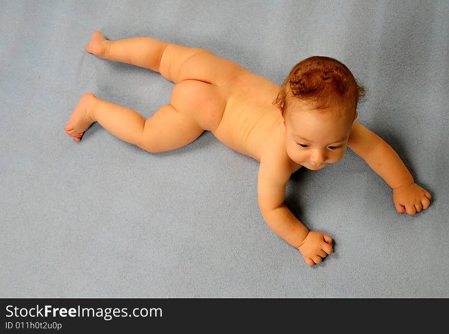 Baby boy isolated over blue