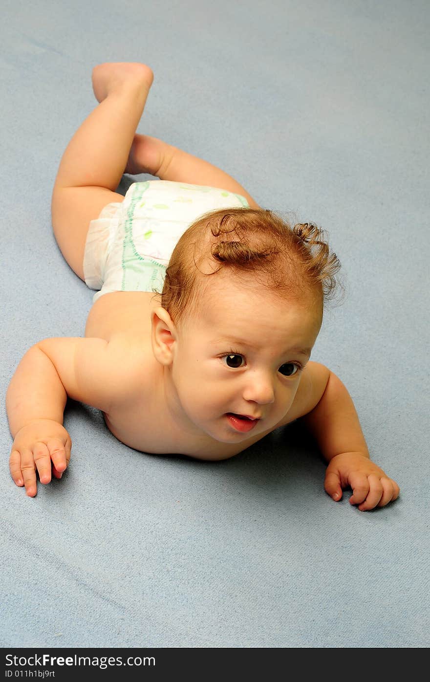 Baby boy isolated over blue