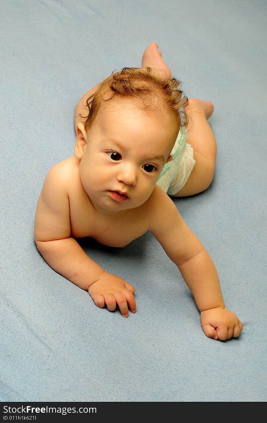 Baby boy isolated over blue