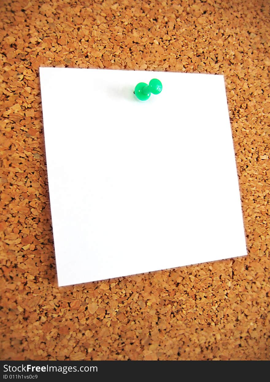 White blank note pind to cork board. White blank note pind to cork board