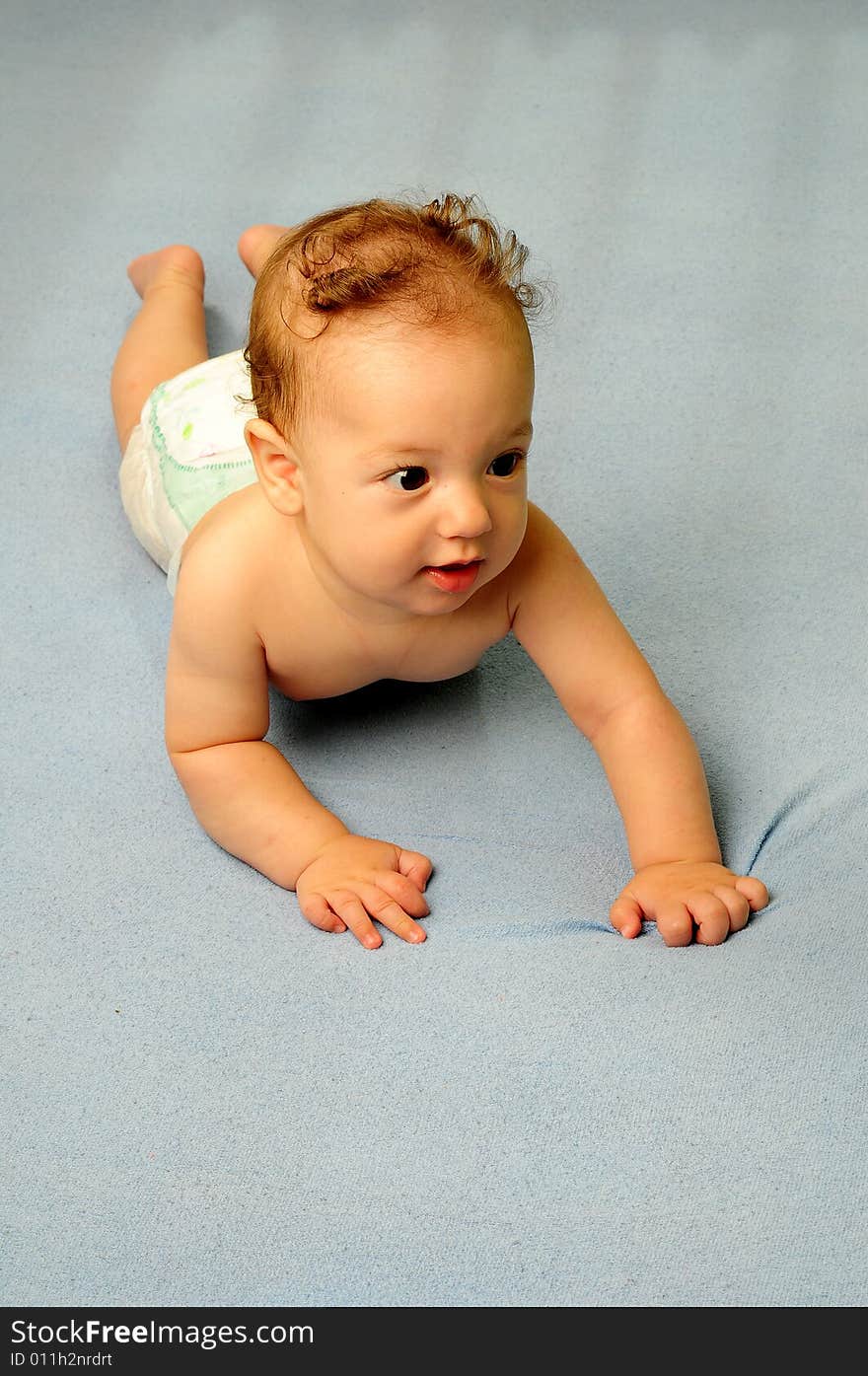 Baby boy isolated over blue