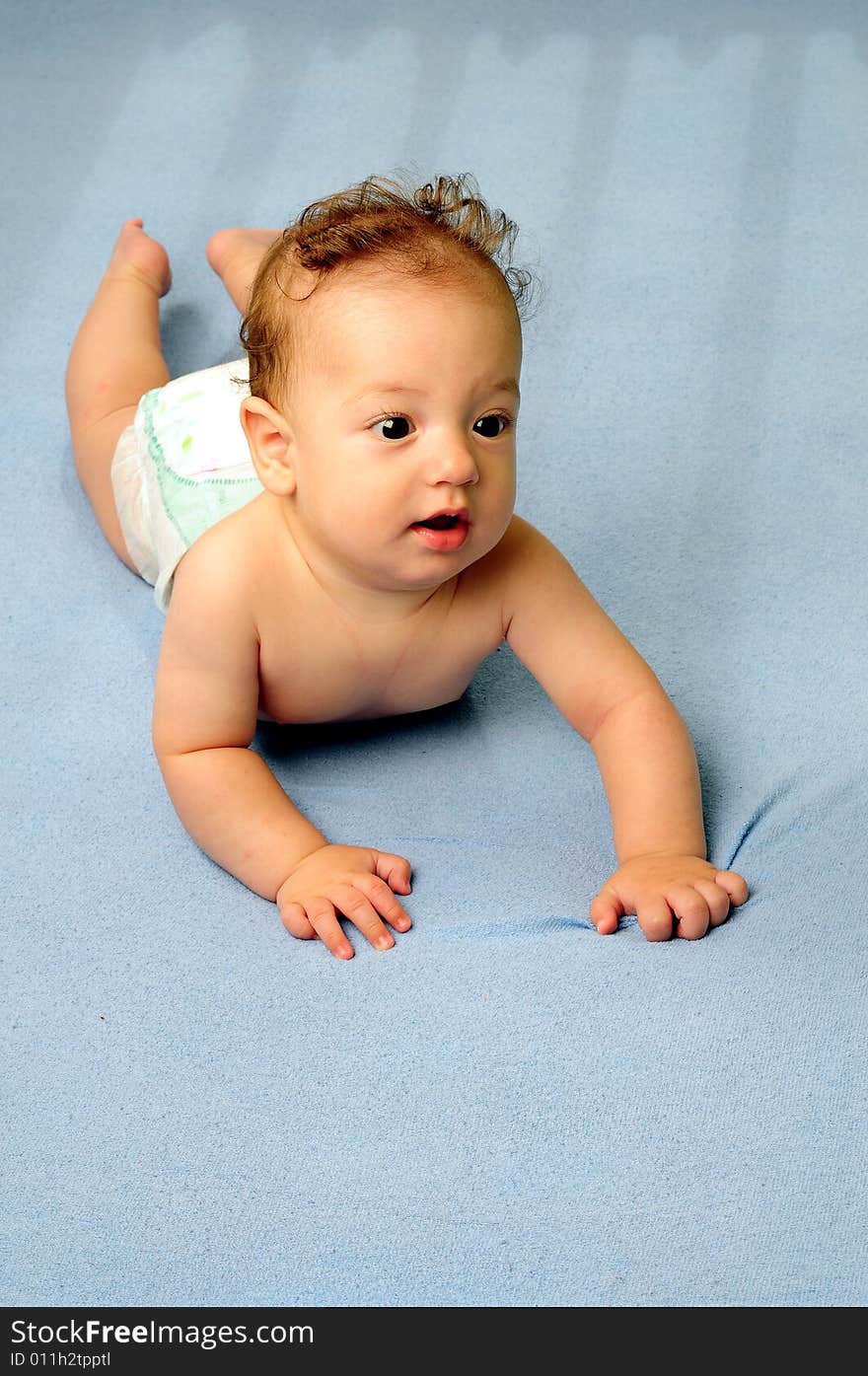 Baby boy isolated over blue