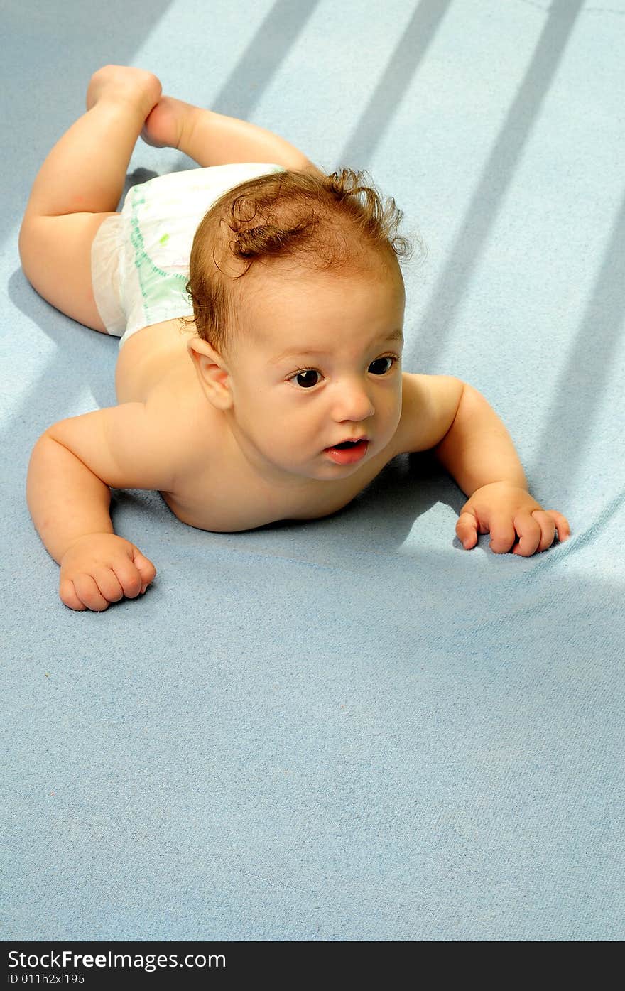 Baby boy isolated over blue