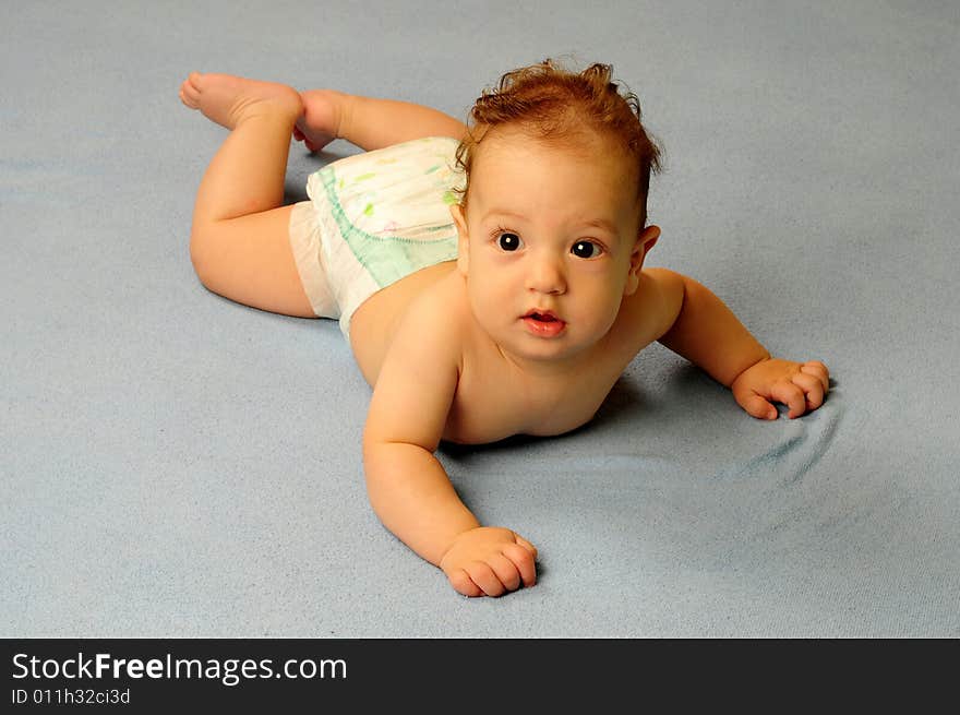 Baby boy isolated over blue