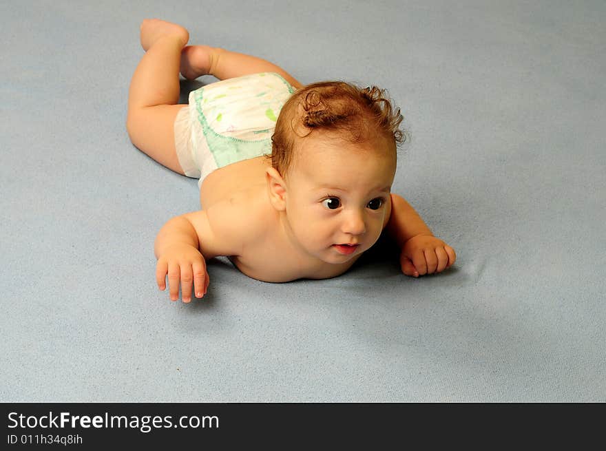 Baby boy isolated over blue