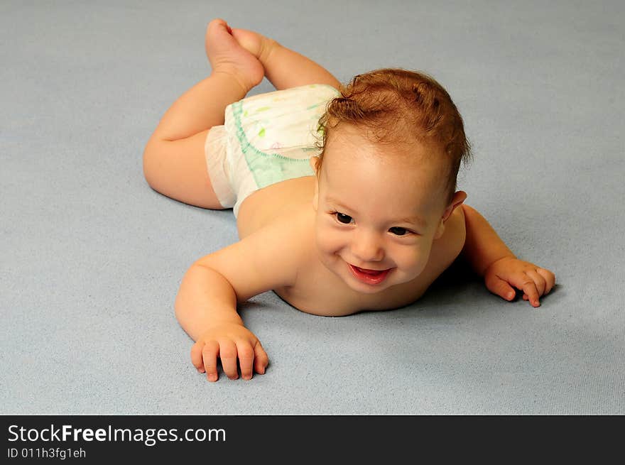 Baby boy isolated over blue