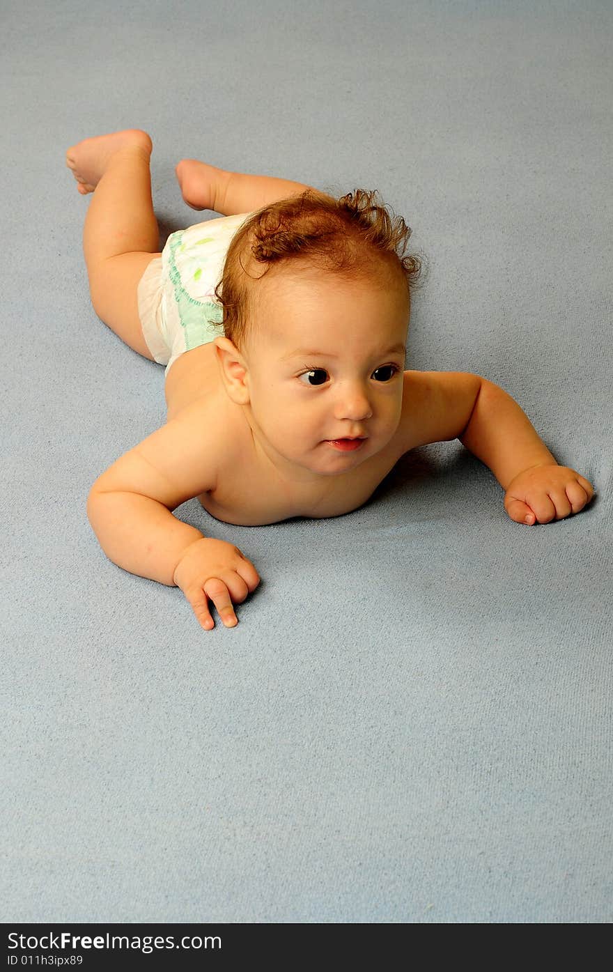 Baby boy isolated over blue