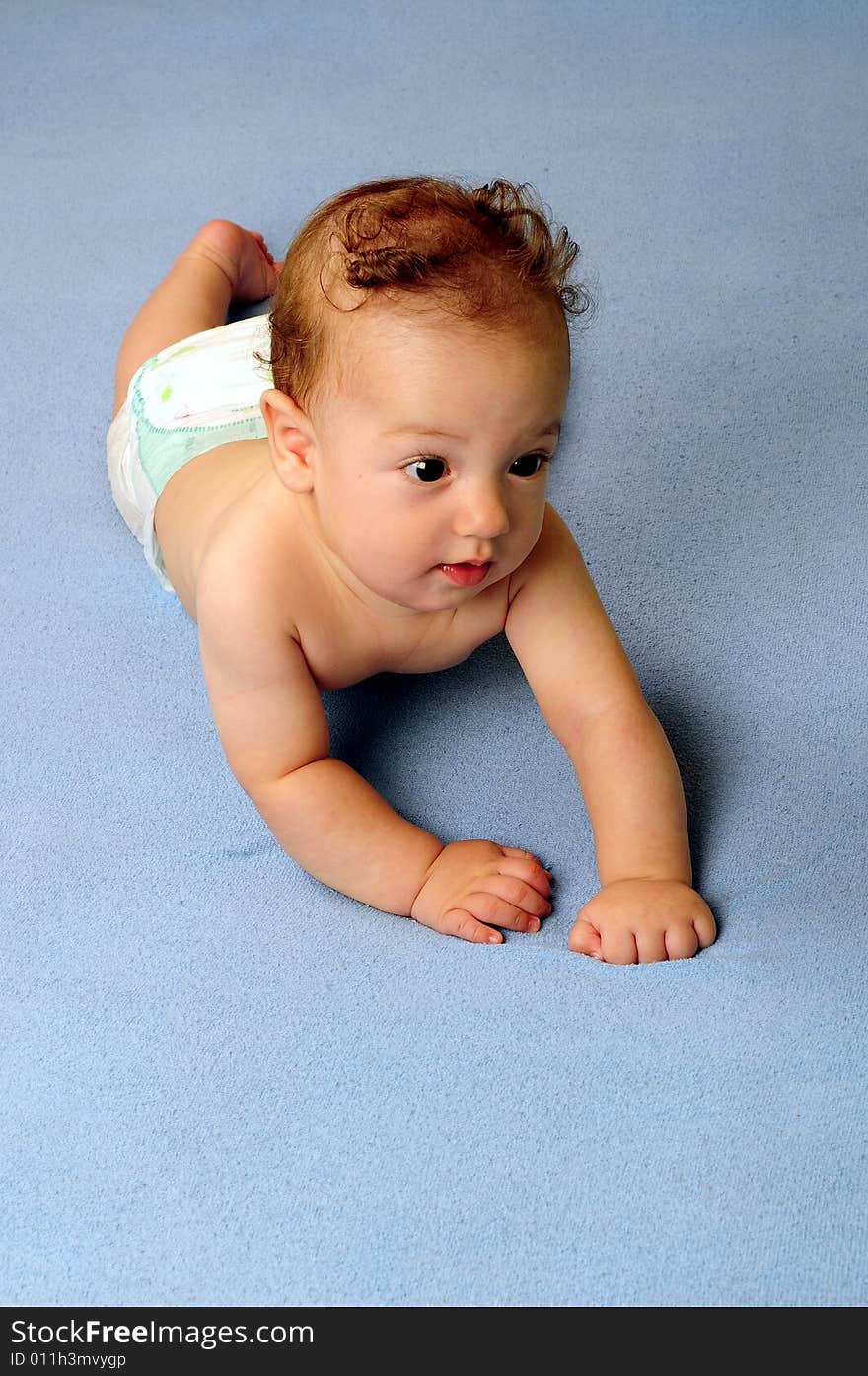 Baby boy isolated over blue