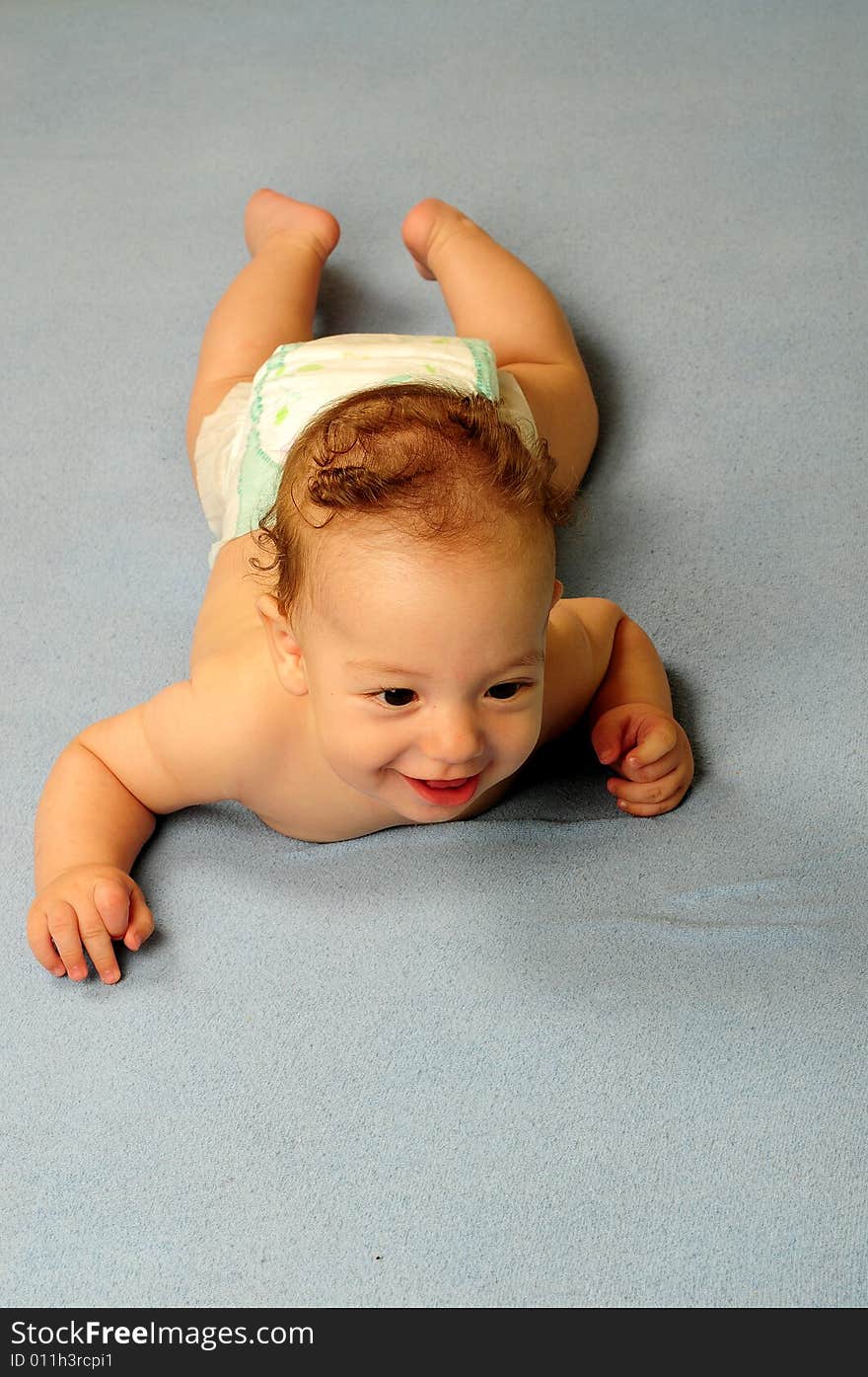 Baby boy isolated over blue