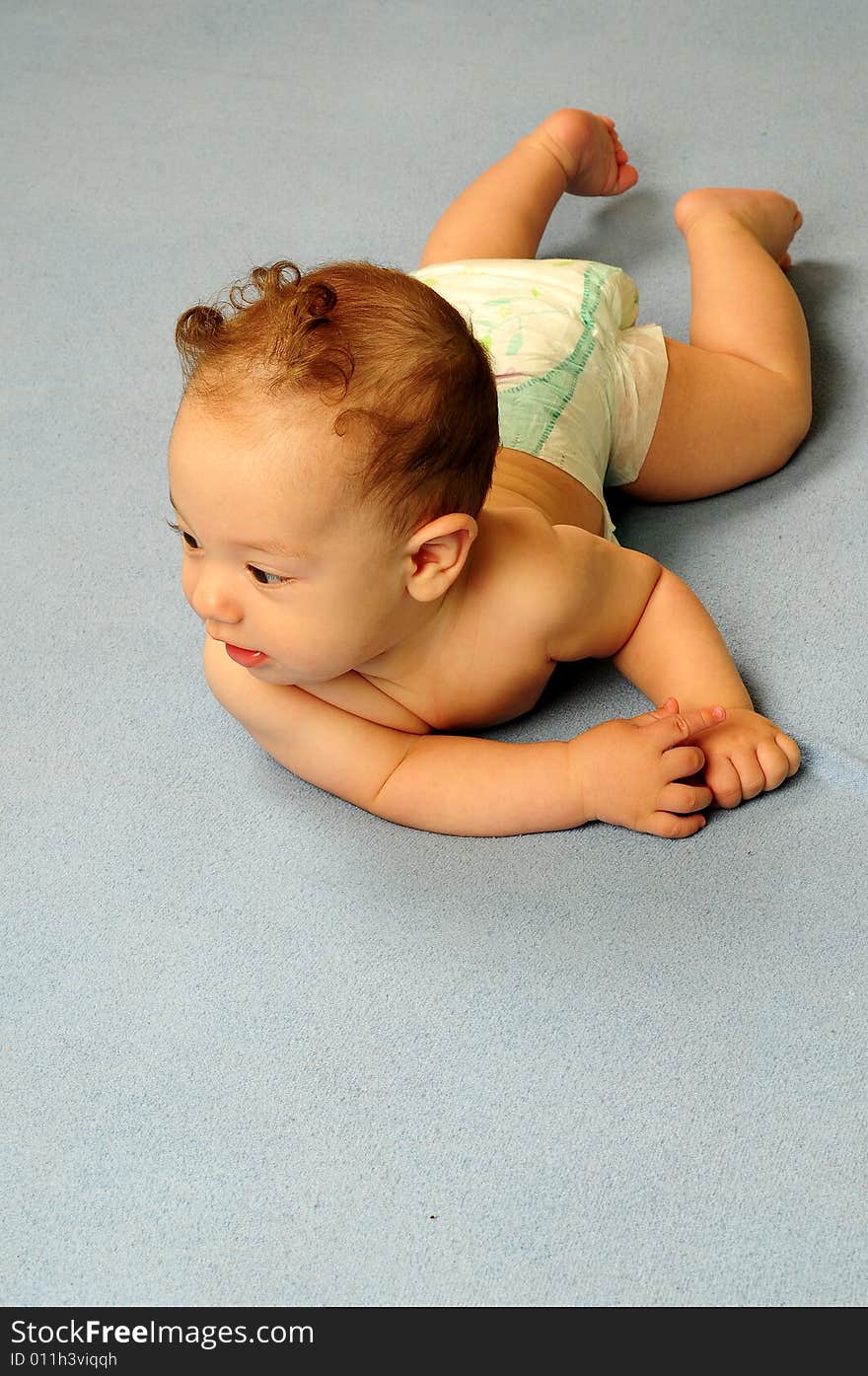 Baby boy isolated over blue