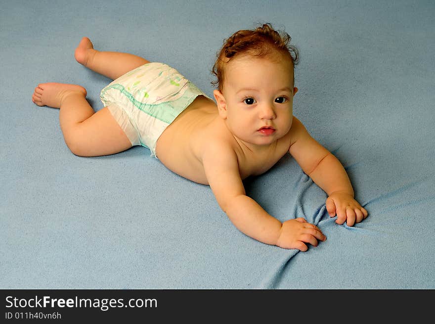 Baby boy isolated over blue