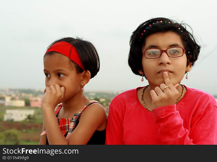 A girls wondering about something, thinking hard to find the solution. A girls wondering about something, thinking hard to find the solution.