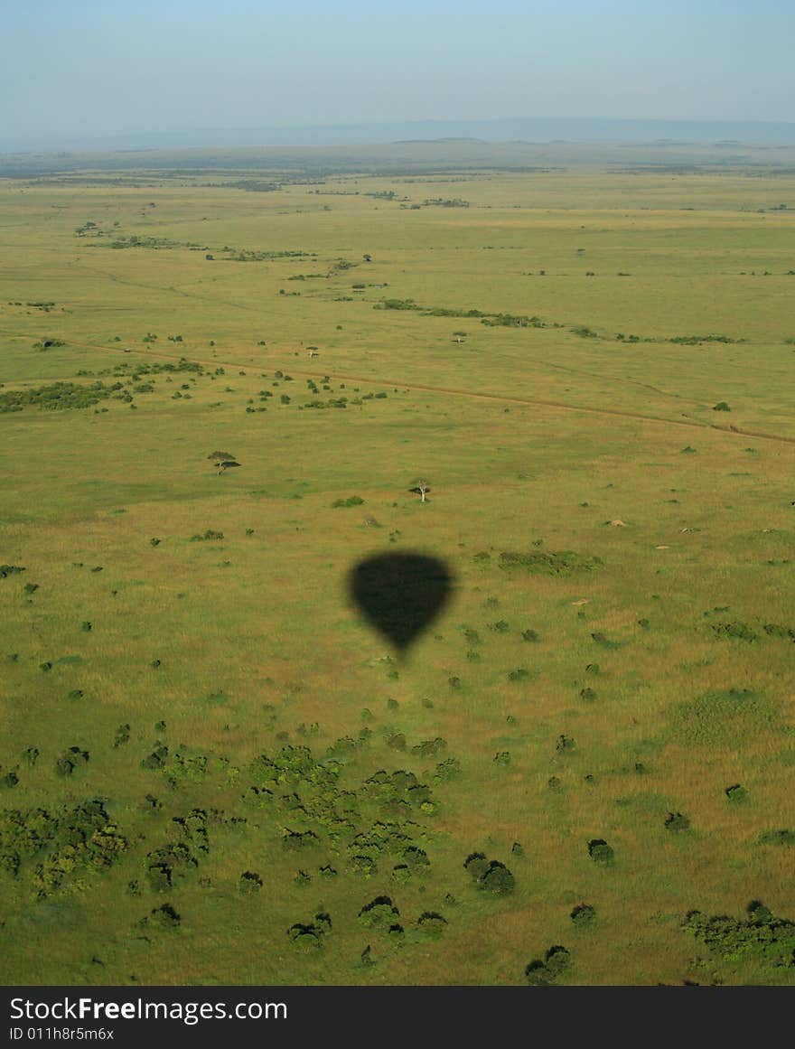 Balloon shadow over the Masai Mara Kenya Africa