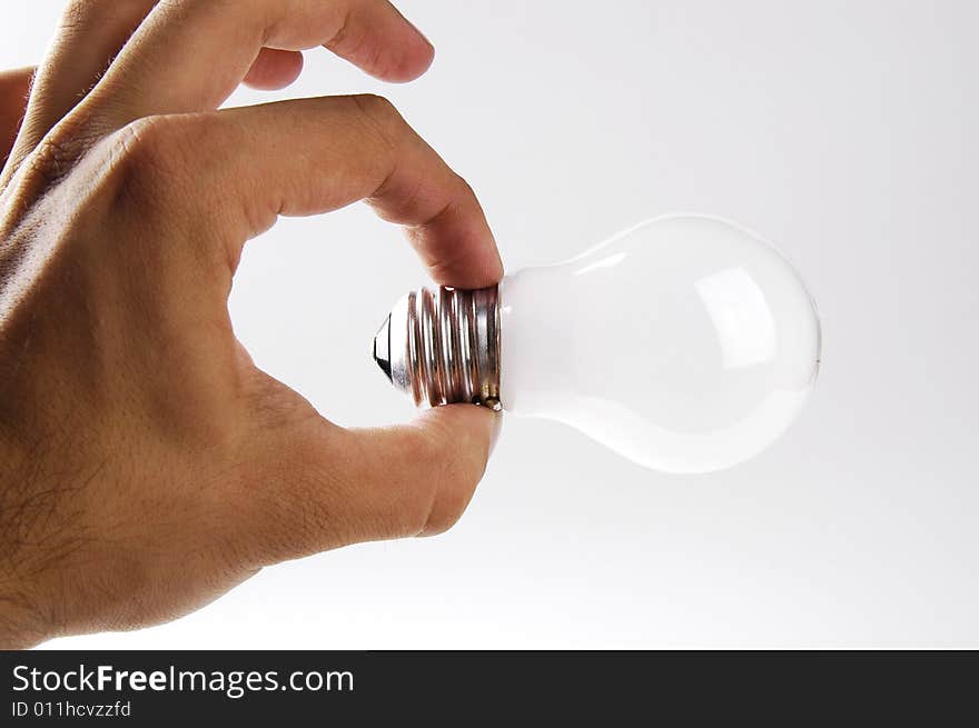 Photo of hand and light bulb